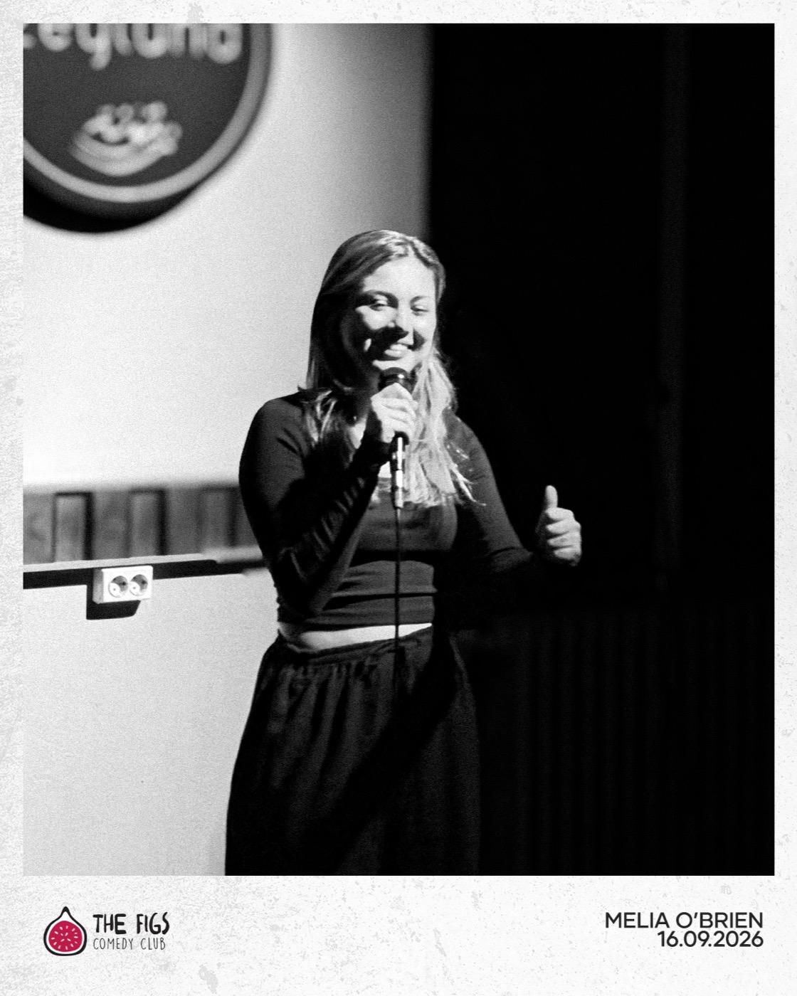 Melia O'Brien giving a thumbs-up on stage