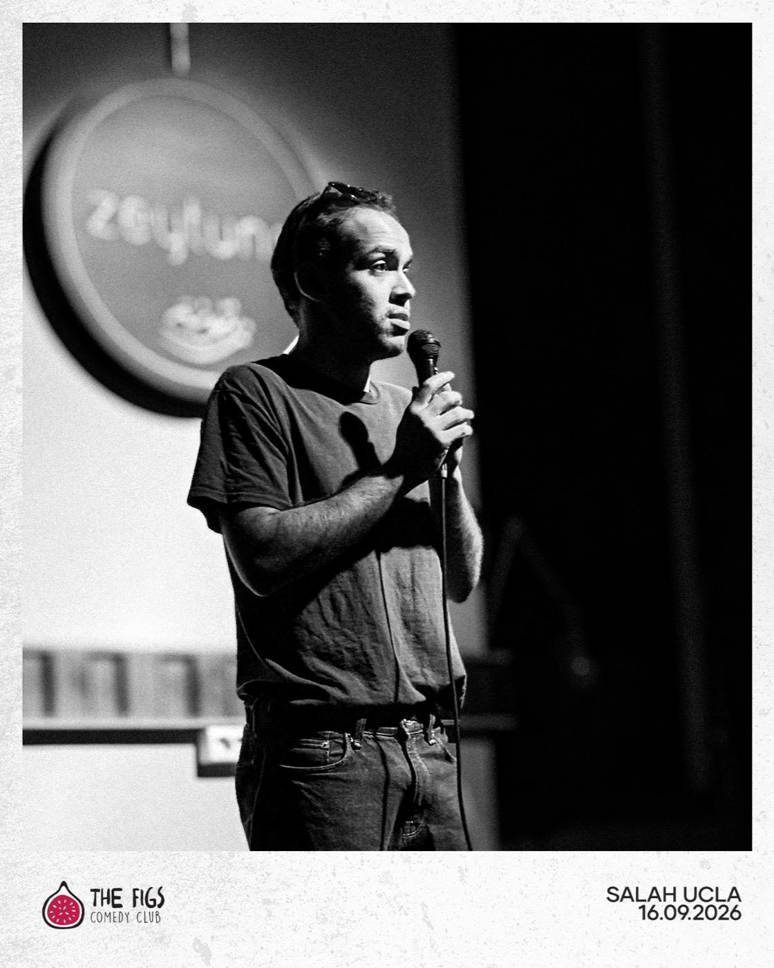 Salah UCLA on stage, mic in hand